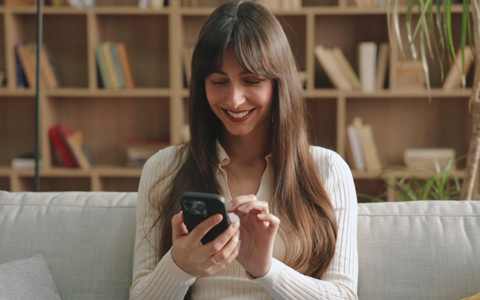 An artist talking a client through a design on her phone